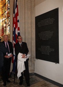 The 7th Earl of Malmesbury, descendant of George Carleton (l) unveils the stone with the names of the officers, assisted by Gary Johnson from the English embassy.